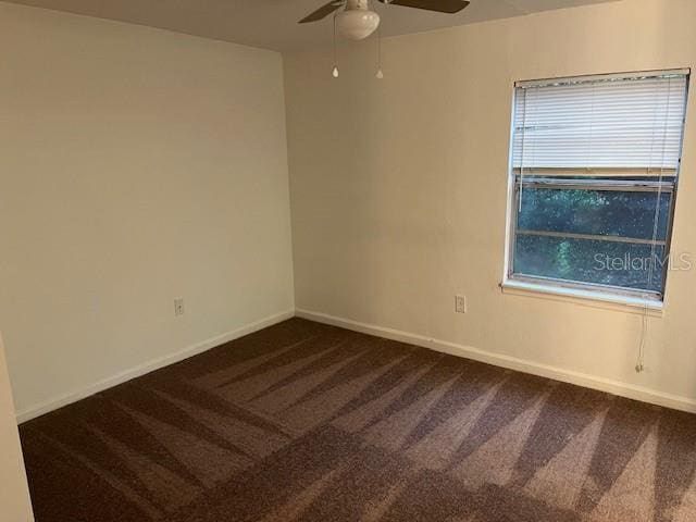 carpeted empty room featuring ceiling fan