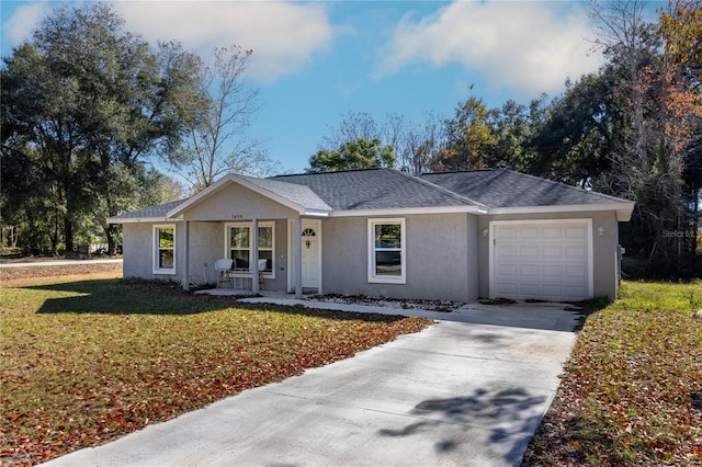 ranch-style home with a porch, a garage, and a front yard