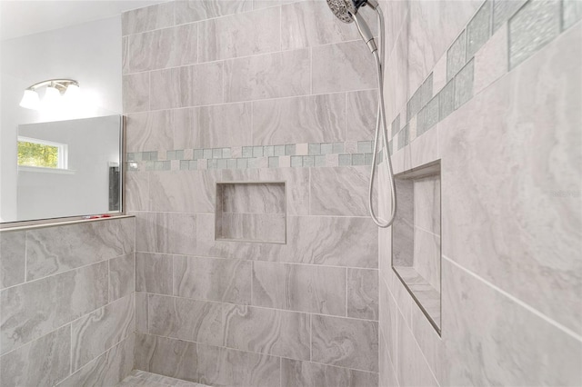 bathroom featuring a tile shower