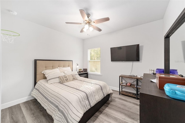 bedroom featuring ceiling fan and light wood-type flooring