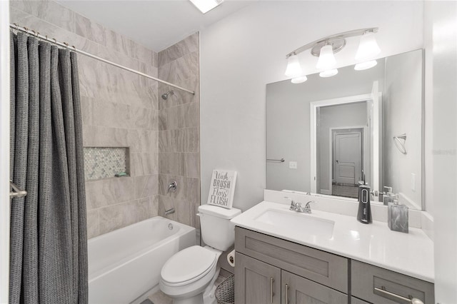 full bathroom with vanity, shower / tub combo, and toilet