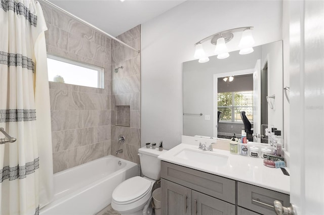 full bathroom with vanity, toilet, and shower / bath combo with shower curtain