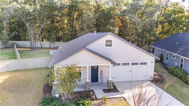 view of front of home featuring a porch, a garage, and a front yard