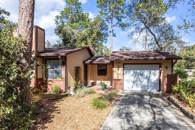 ranch-style house featuring a garage