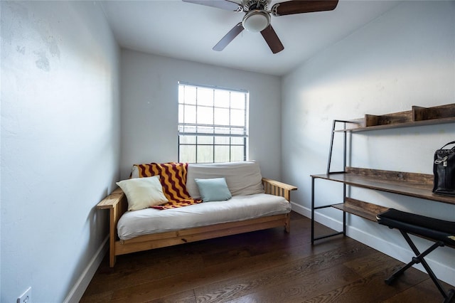 sitting room with ceiling fan, lofted ceiling, and dark wood-type flooring