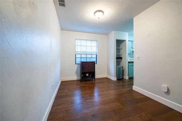 2116 SW 73rd St, Gainesville, FL 32607 - empty room featuring dark wood finished floors and baseboards