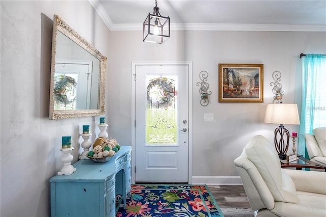 foyer entrance featuring dark wood-type flooring and ornamental molding