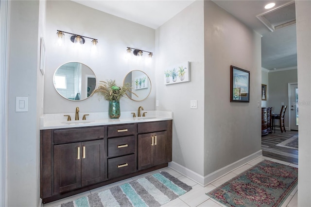 bathroom with vanity, tile patterned floors, and crown molding