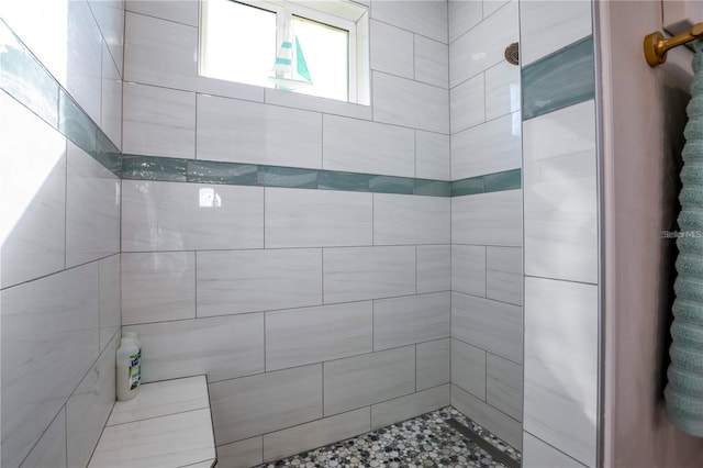 bathroom featuring tiled shower