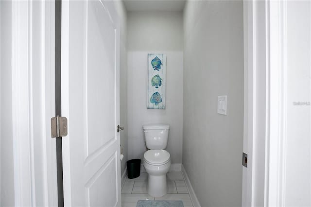 bathroom featuring tile patterned flooring and toilet