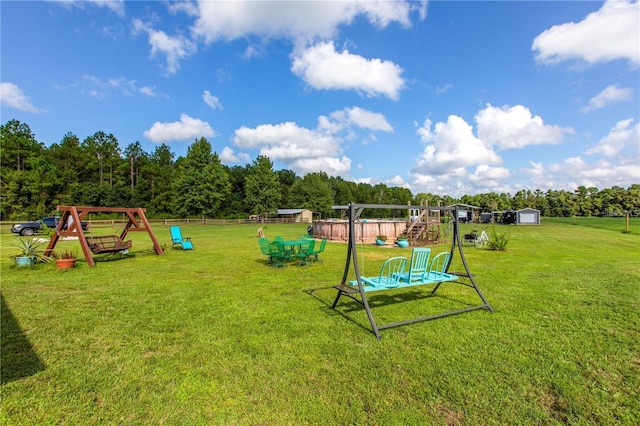 view of play area with a yard