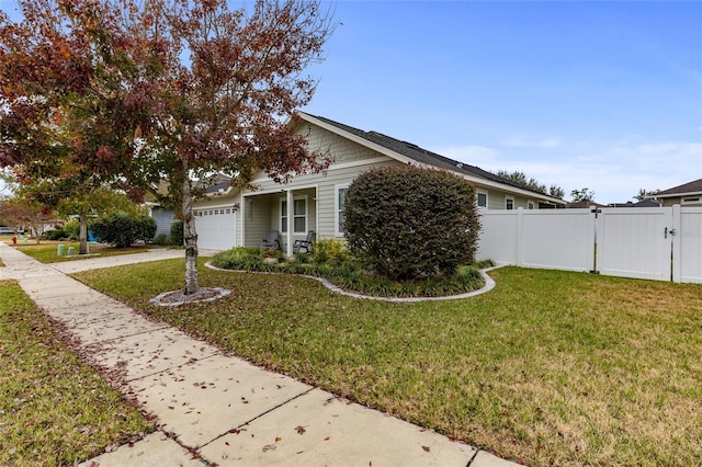 view of front of property with a front lawn and a garage