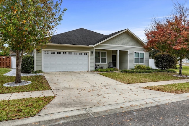 view of front of home featuring a garage and a front yard