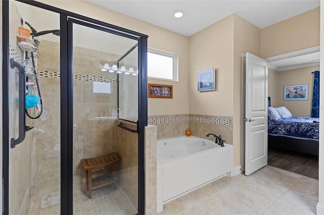 bathroom featuring tile patterned floors and separate shower and tub