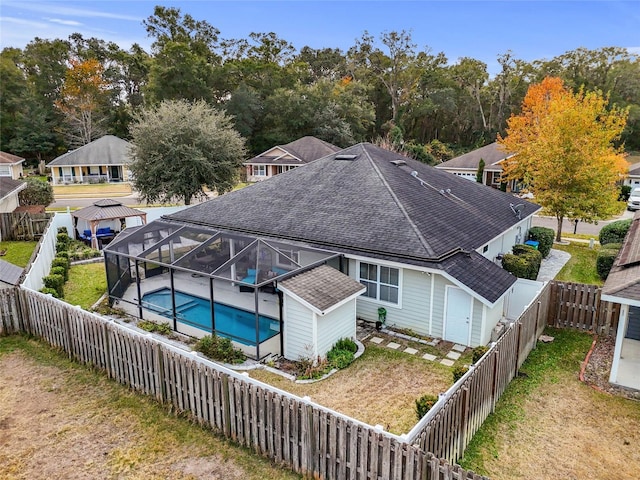 exterior space with a patio area, a lanai, and a fenced in pool