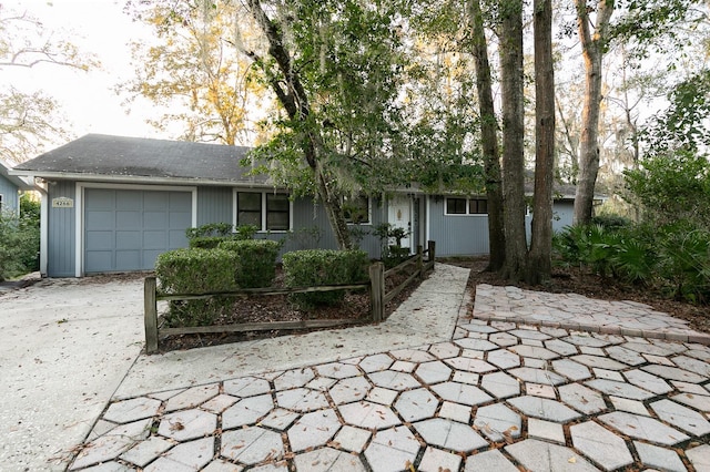 single story home with a garage