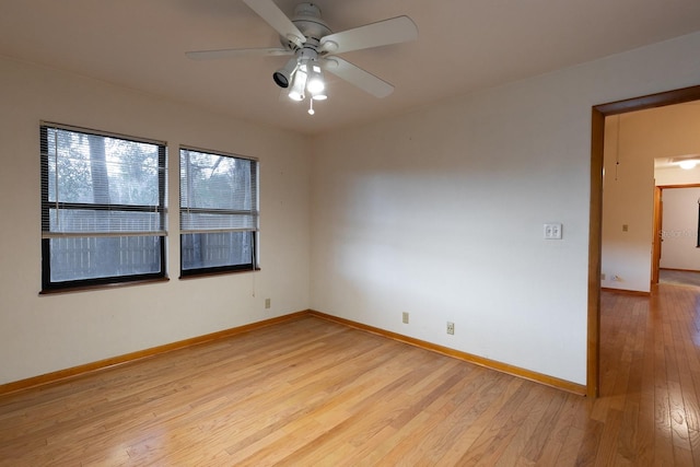 unfurnished room featuring ceiling fan and light wood-type flooring