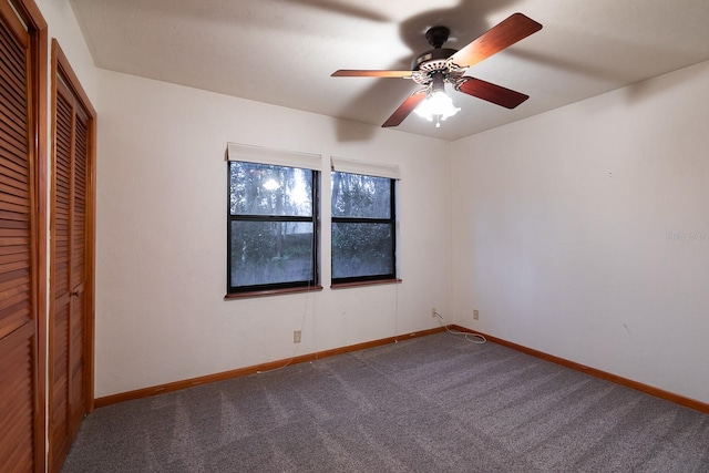 unfurnished bedroom with carpet flooring, ceiling fan, and a closet