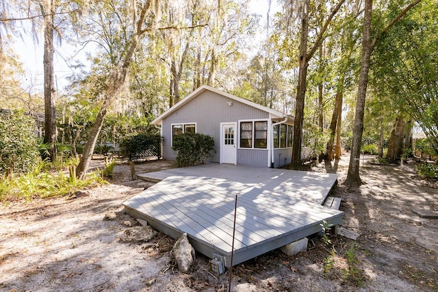 exterior space with a deck and a sunroom