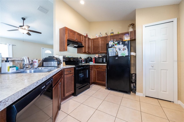 kitchen featuring ceiling fan, sink, vaulted ceiling, light tile patterned flooring, and black appliances