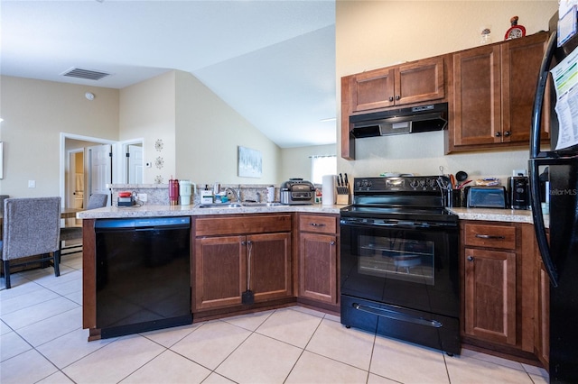 kitchen with sink, kitchen peninsula, lofted ceiling, light tile patterned flooring, and black appliances