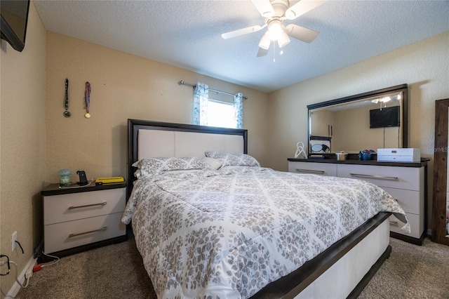 carpeted bedroom featuring a textured ceiling and ceiling fan