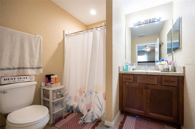 bathroom featuring a shower with curtain, vanity, and toilet