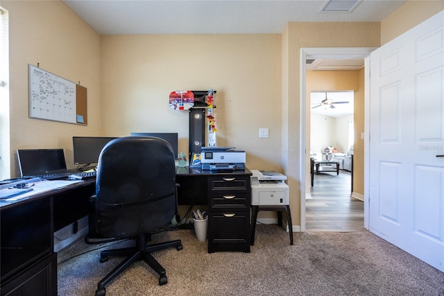 office space featuring wood-type flooring and ceiling fan