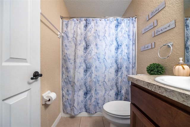 bathroom with vanity, a textured ceiling, tile patterned flooring, toilet, and curtained shower