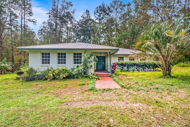 ranch-style house with a front lawn