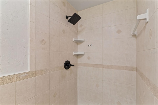 bathroom with a tile shower