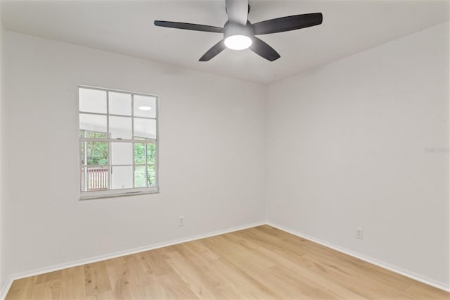 spare room featuring ceiling fan and hardwood / wood-style flooring