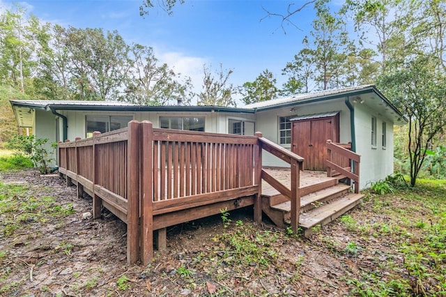 rear view of property with a deck