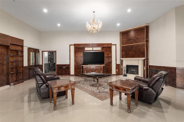 living room featuring light tile patterned floors and a notable chandelier