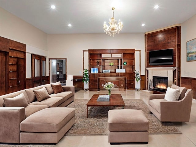 living room featuring a notable chandelier, wood walls, and light tile patterned flooring