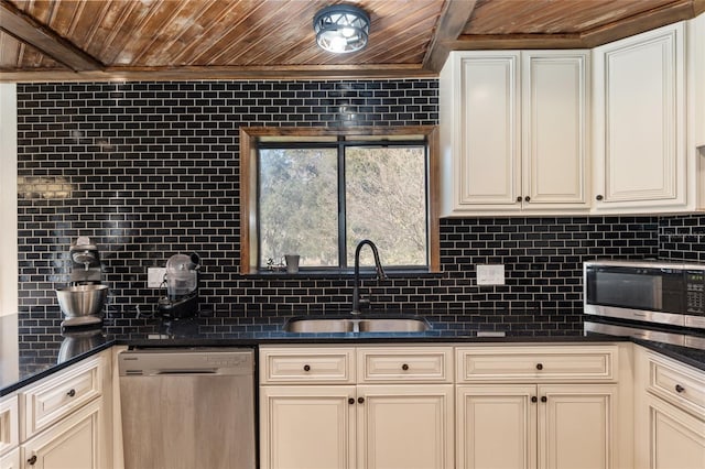 kitchen with sink, stainless steel appliances, wood ceiling, and tasteful backsplash