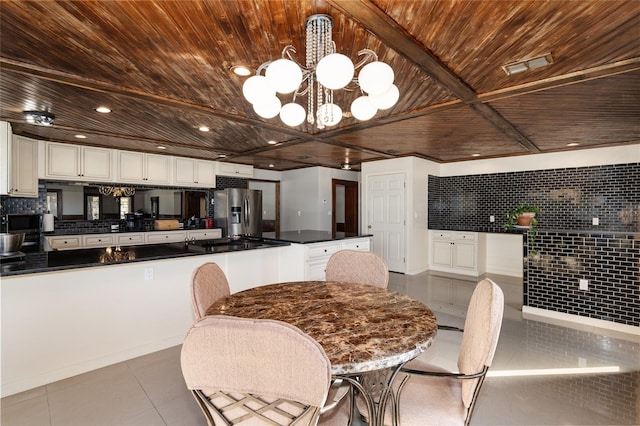 tiled dining area featuring wooden ceiling and an inviting chandelier