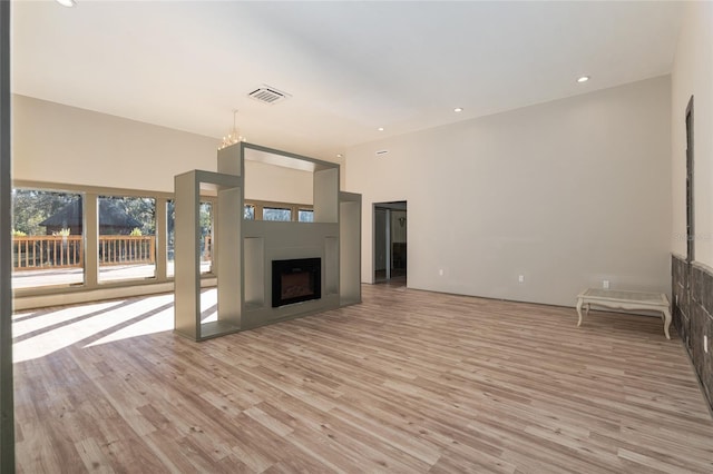 unfurnished living room with light wood-type flooring