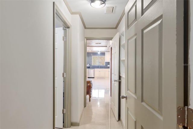 hall featuring crown molding and plenty of natural light