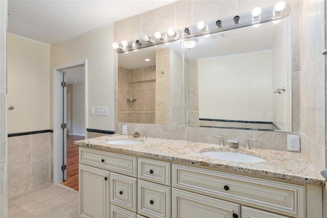 bathroom featuring vanity, tile walls, and tile patterned floors