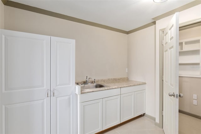 bathroom with tile patterned flooring and vanity