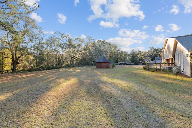 view of yard featuring a wooden deck