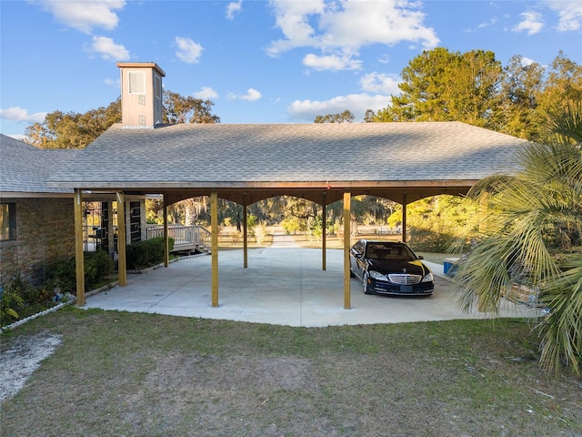 view of parking with a yard