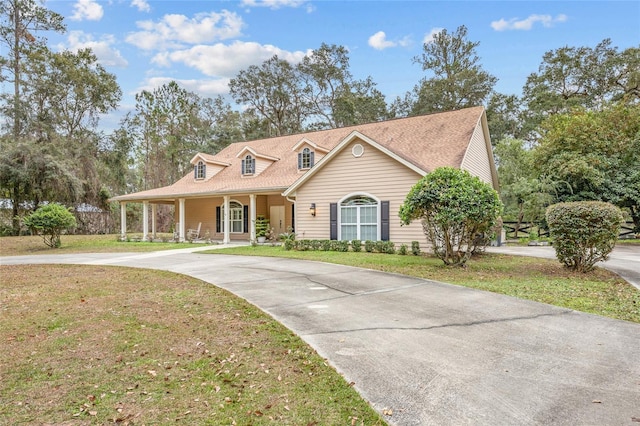 view of front of property with a front yard and a porch