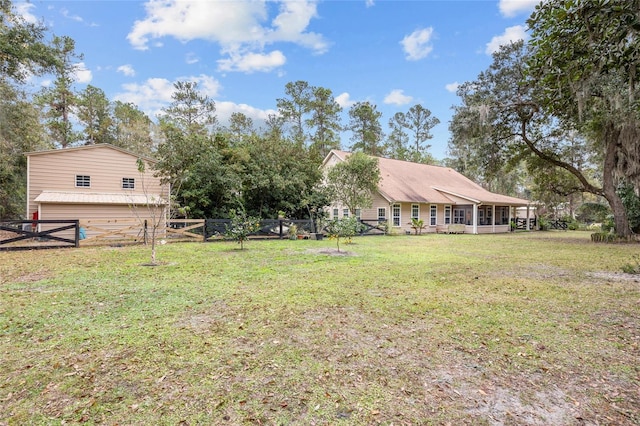 view of yard featuring a sunroom