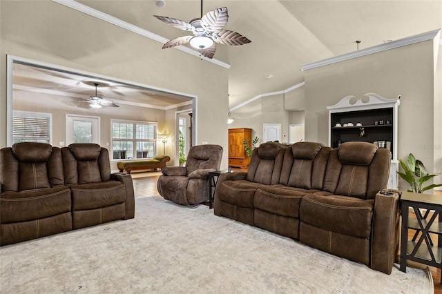 living room with ceiling fan, lofted ceiling, and ornamental molding