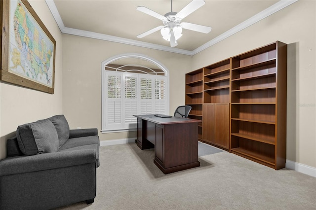 carpeted home office with ceiling fan and crown molding