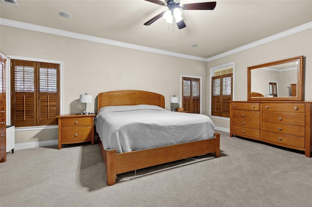 bedroom with ceiling fan, light colored carpet, and ornamental molding