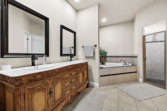 bathroom with tile patterned flooring, vanity, and plus walk in shower