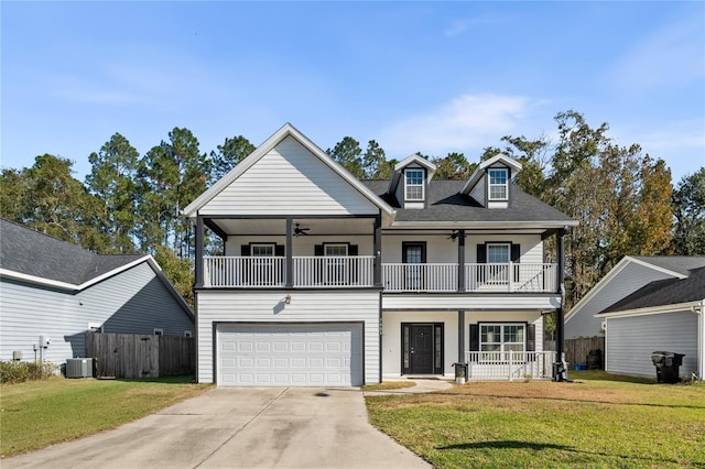 view of front of house with central air condition unit, a balcony, a front lawn, a garage, and a porch